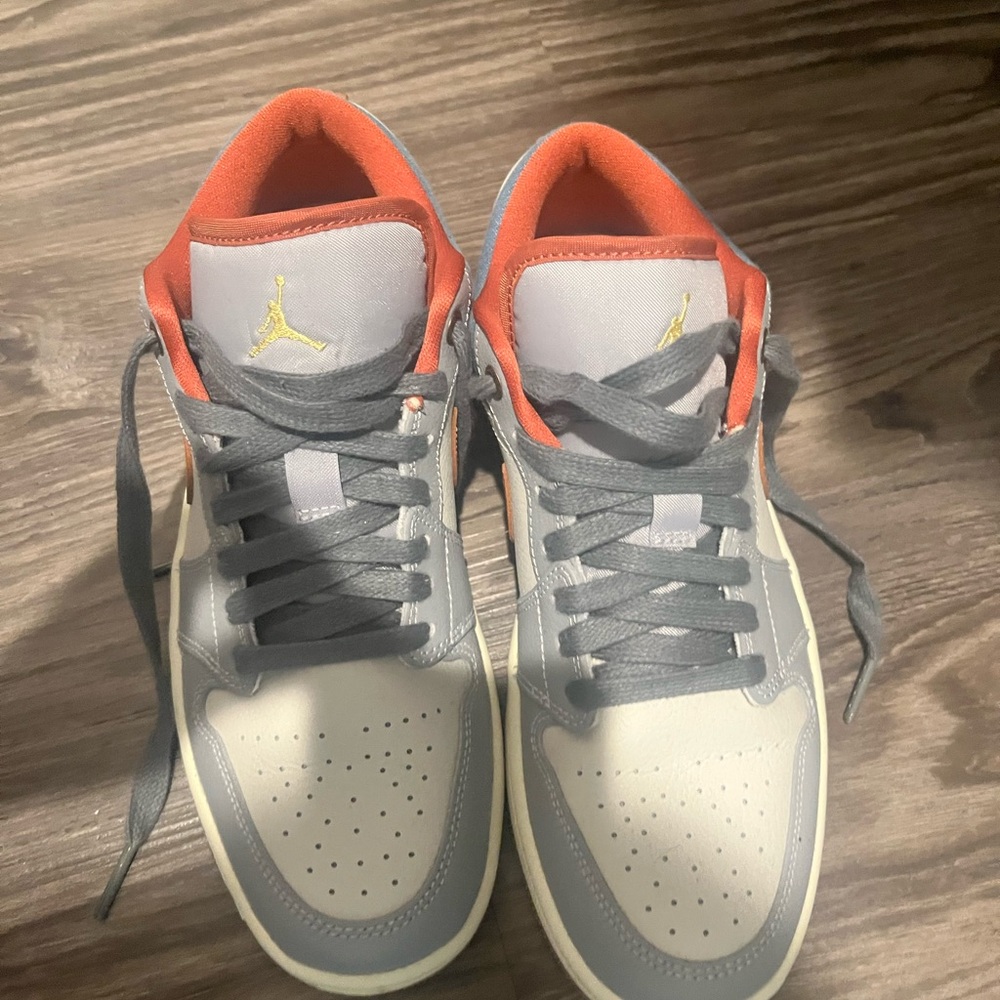 Gray and White Sneakers with Red Accents